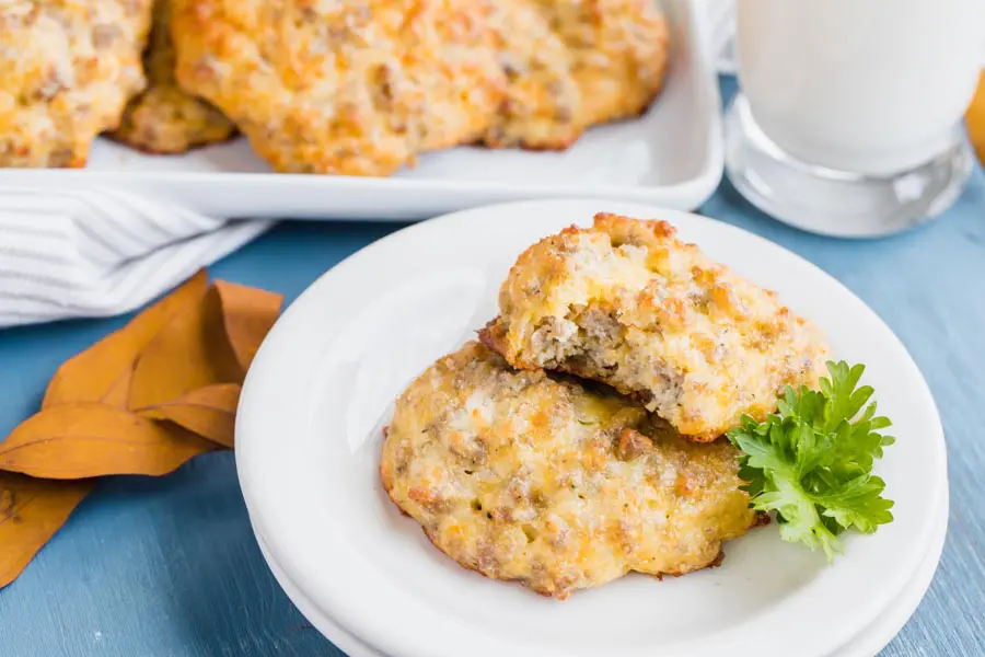 two biscuits on a plate one with half eaten