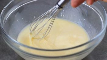 whisking egg mixture in a bowl