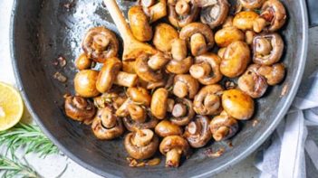 buttery sauteed mushrooms in a skillet