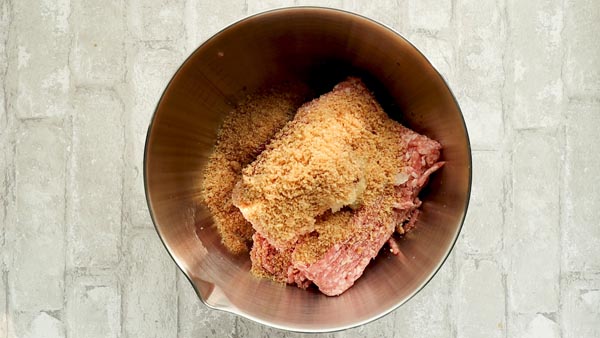 pork panko on top of meatloaf ingredients in a bowl