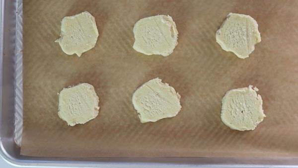 keto shortbread cookie circles on a baking tray