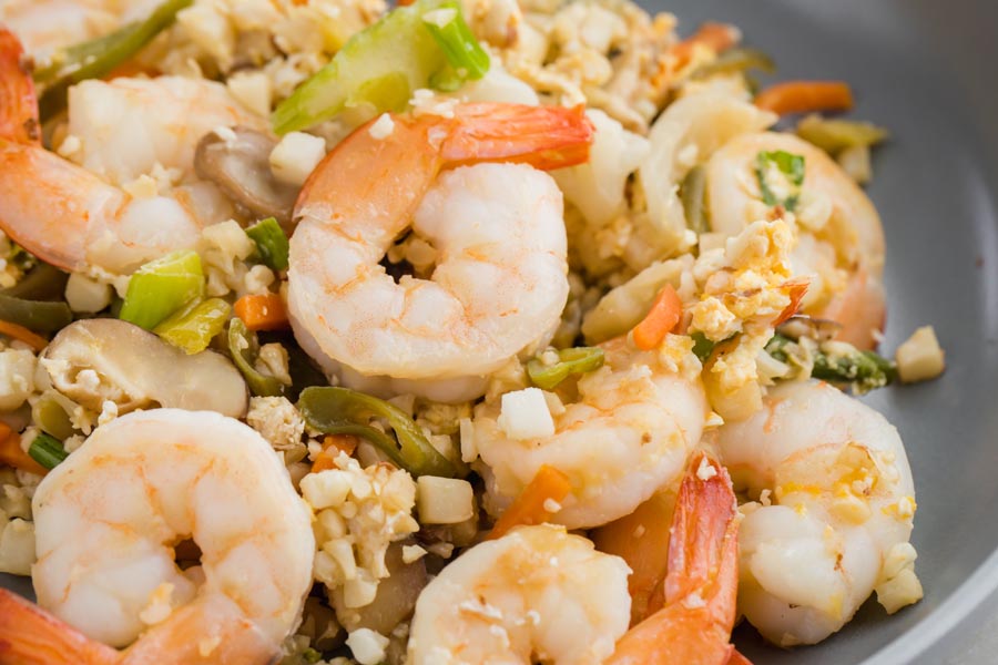 juicy shrimp mixed in with cauliflower fried rice