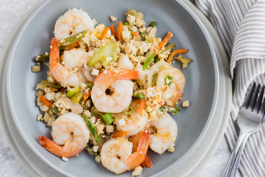 overhead view of a plate of keto fried rice with shrimp and vegetables