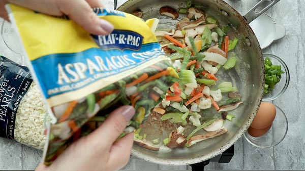 asparagus stir fry mix poured into a skillet