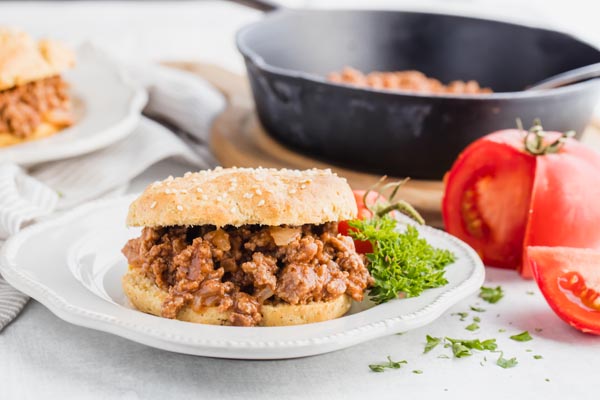 a plate of keto sloppy joes with a cast iron skillet behind