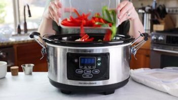 dumping sliced peppers into crock pot