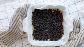 dark chocolate chips spread in a baking dish