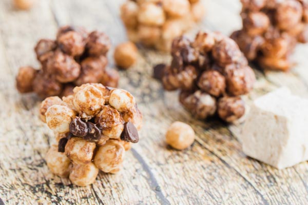 round smores bites filled with cereal chocolate and a marshmallow near by