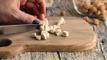 cutting a marshmallow into small chunks