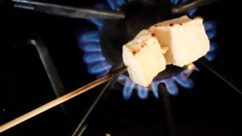 roasting marshmallows over a gas stove top