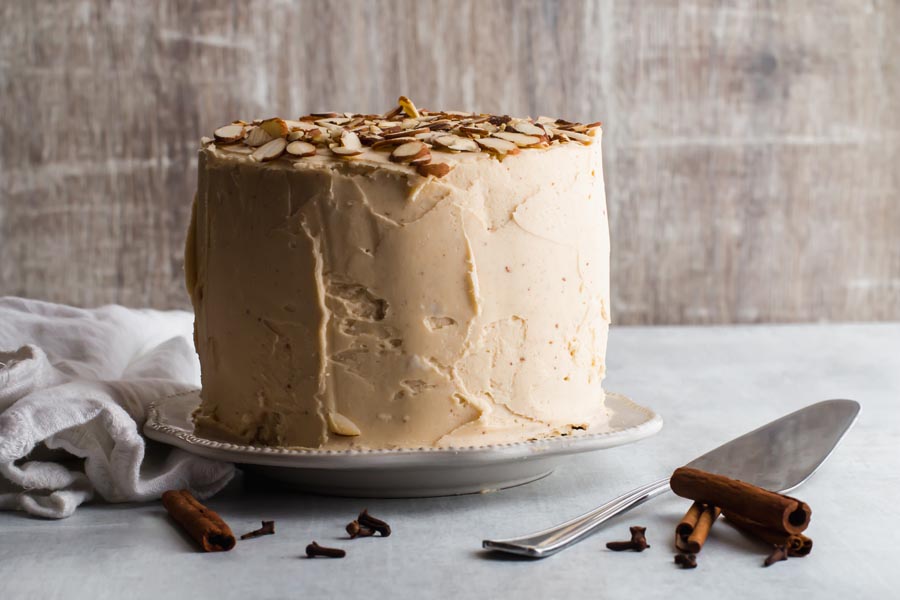 keto spice cake on a plate next to a serving spatula