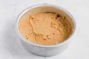 spice cake batter in a cake pan ready to bake