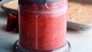 pureeing strawberries in a mini food processor