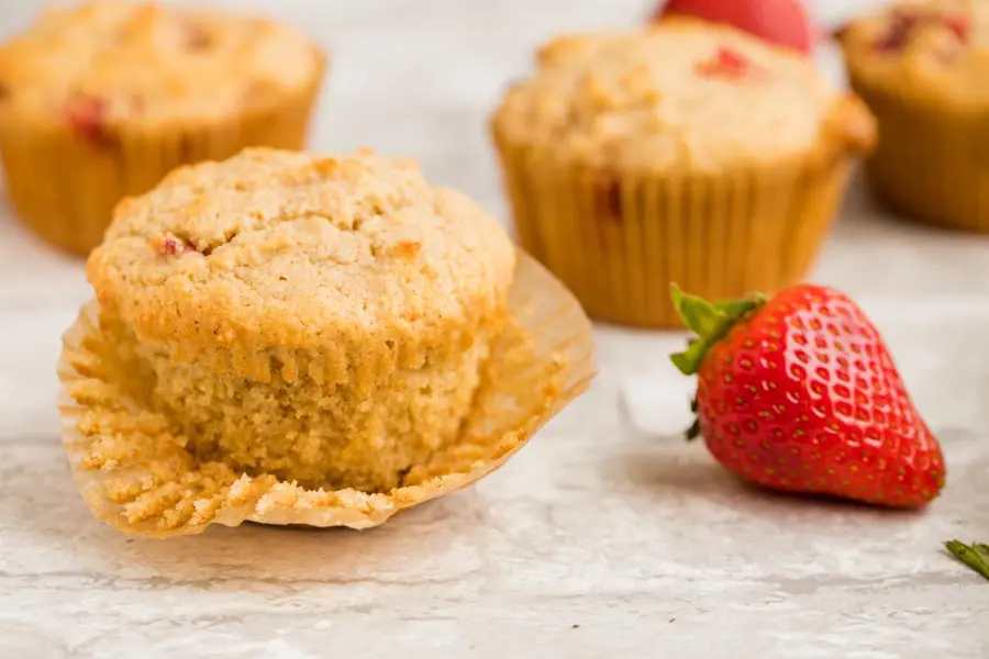 a muffin liner peeled off of a muffin