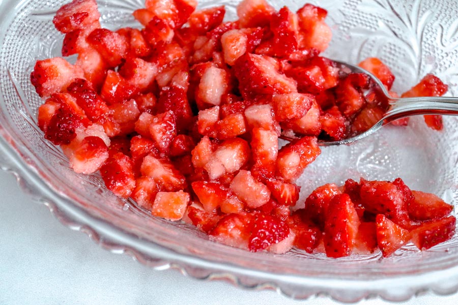 chopped strawberries in a clear bowl
