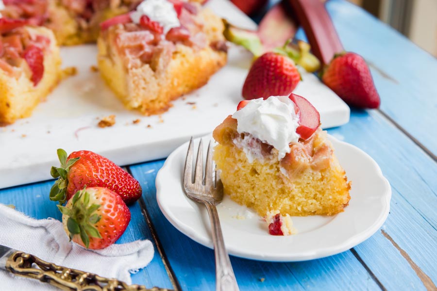 eating sugar free strawberry rhubarb cake with a fork