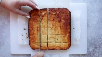 cutting cake into squares with a knife