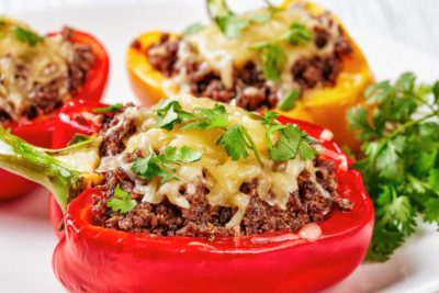ground beef stuffed red peppers on a plate