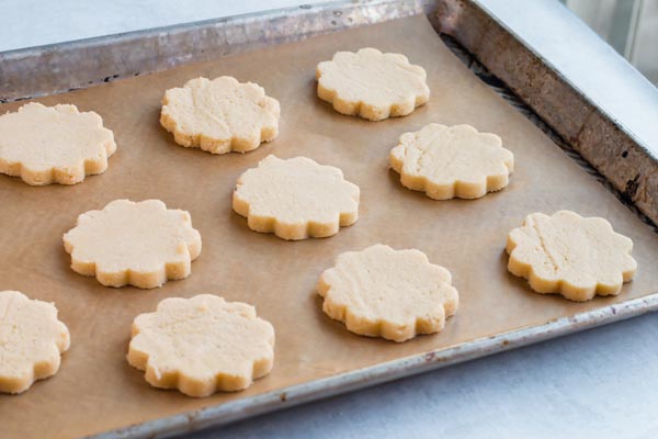 keto sugar cookie cut outs on a baking tray