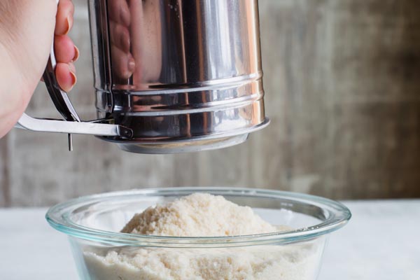 sifting keto flours together