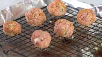 gluten free keto taco meatballs on a wire rack baking tray