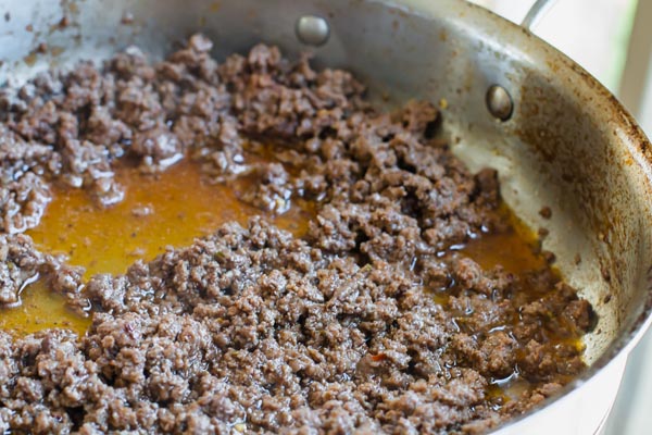 ground beef cooking with taco seasoning