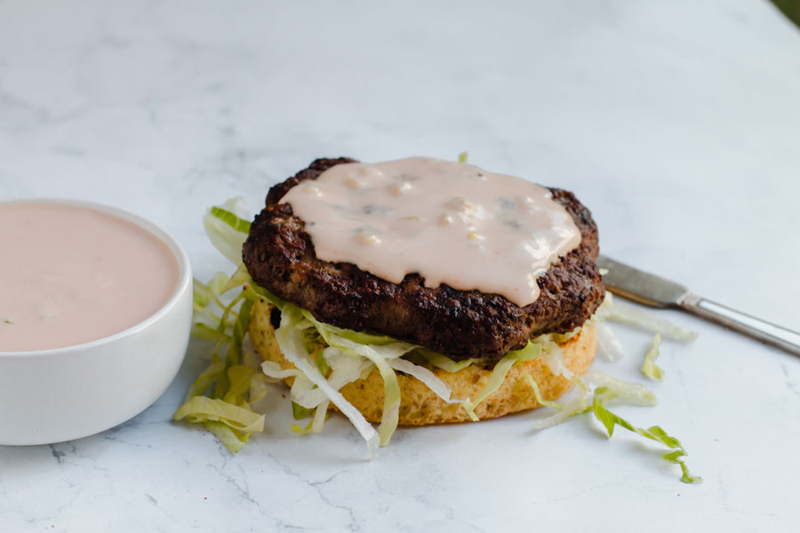 keto thousand island dressing spread on a burger