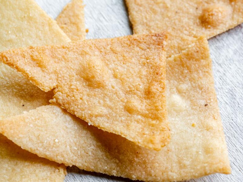 close up of crispy looking tortilla chips in a stack