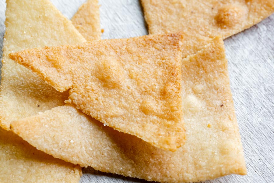 close up of crispy looking tortilla chips in a stack