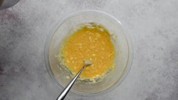 Egg yolks and sweetener whisked together in a bowl for the keto ice cream custard.