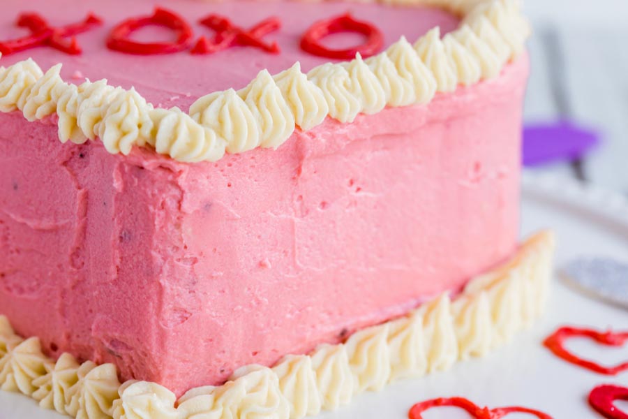 pink and white frosted cake