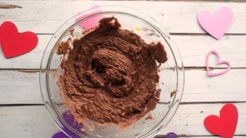 chocolate cake batter with hearts around it