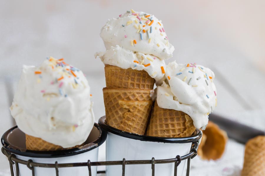 three cones in a white enamel cup