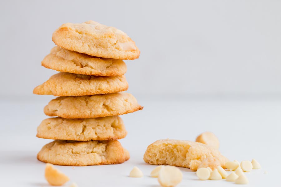 a stack of white chocolate macadamia nut cookies