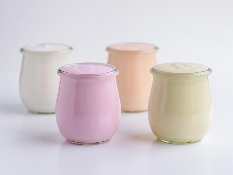 Flour yogurt flavors next to each other in glass jars.