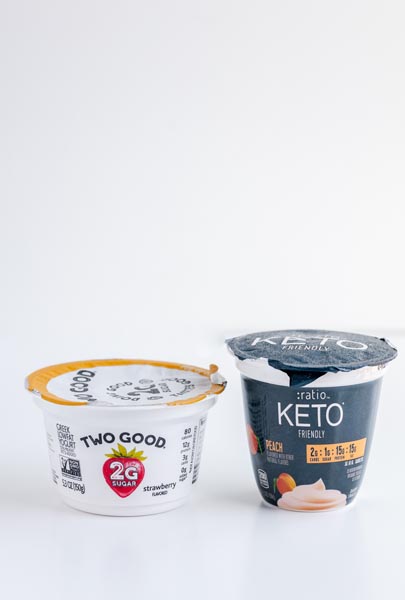 Two yogurt brands are side by side. One is a container of Two Good yogurt. The other is Ratio Keto Friendly Yogurt.