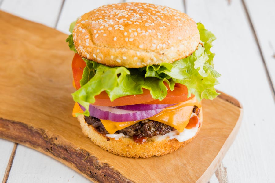 hamburger on a sesame seed keto bun