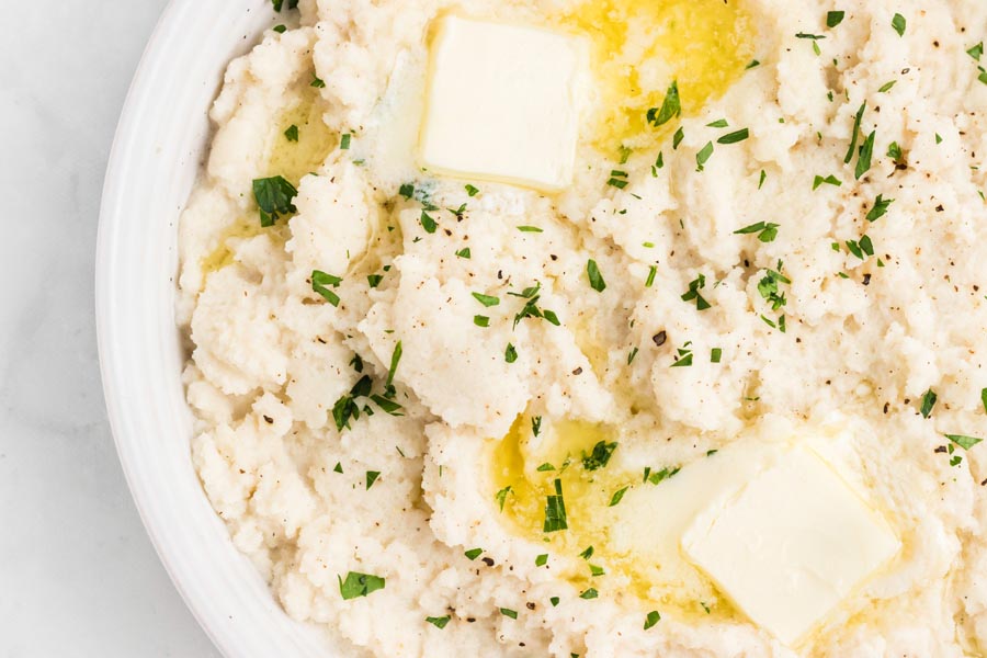 Creamy, fluffy mashed turnips topped with pepper, butter and herbs.