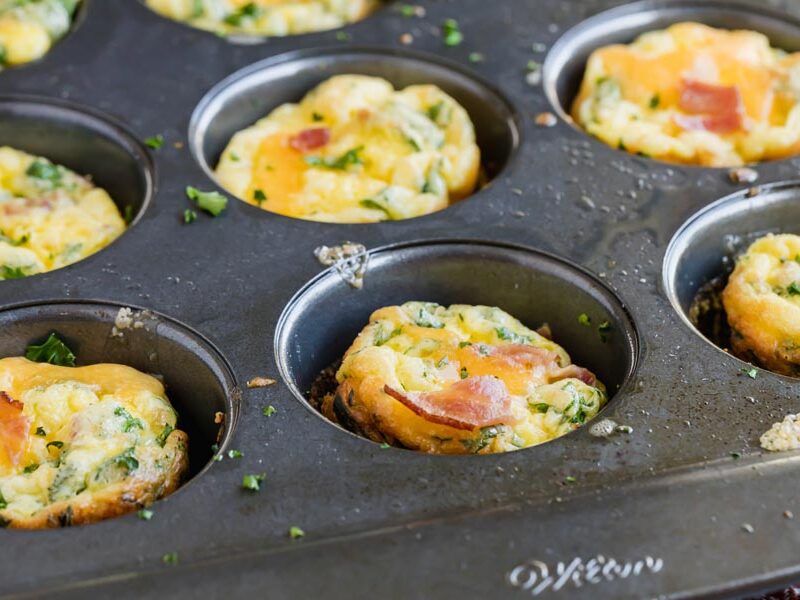 a muffin tin with egg muffins inside