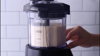 Almond flour pot pie dough ingredients added to a food processor before blending.