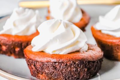 little crustless pumpkin pie topped with whipped cream