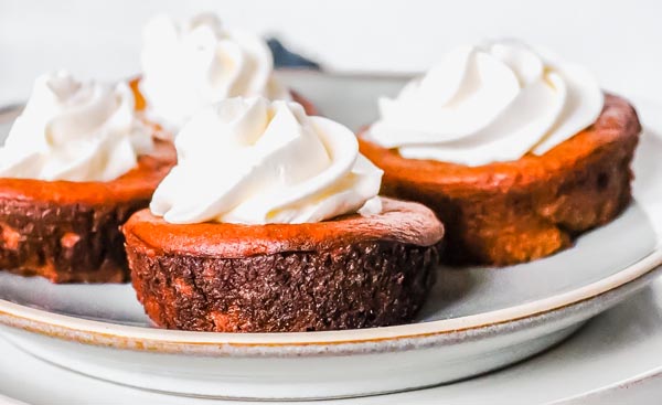 a plate of mini pumpkin pies with no crust
