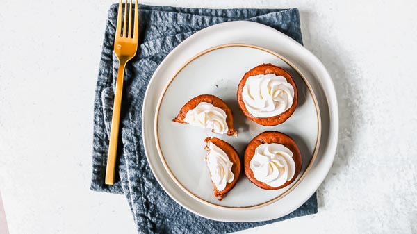 four mini keto pumpkin pies on a plate for thanksgiving