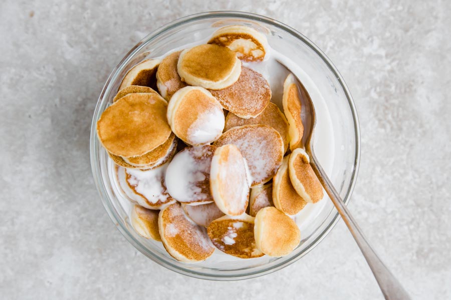 mini keto pancake cereal in a bowl with milk