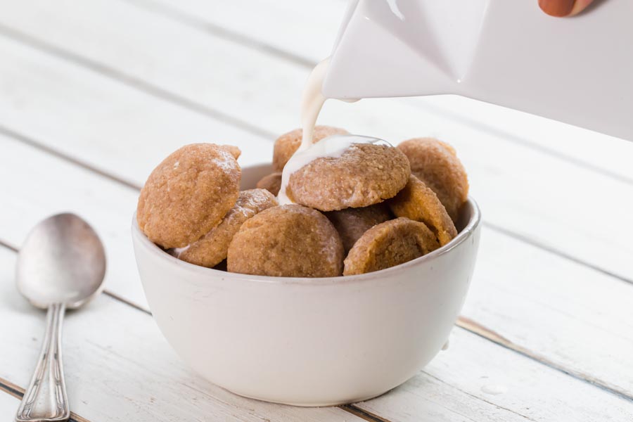 cold heavy cream poured over snickerdoodle cookie cereal