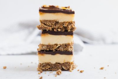 three cookie bars on top of each other with crumbs