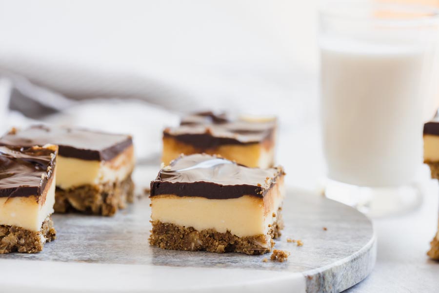 a thick custard layer of a nanaimo bar topped with chocolate