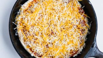 blend of shredded cheese for pizza in a skillet