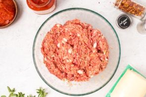 a clear bowl with meatloaf mixed in