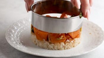 pulling up a biscuit ring to show how a poke bowl is formed